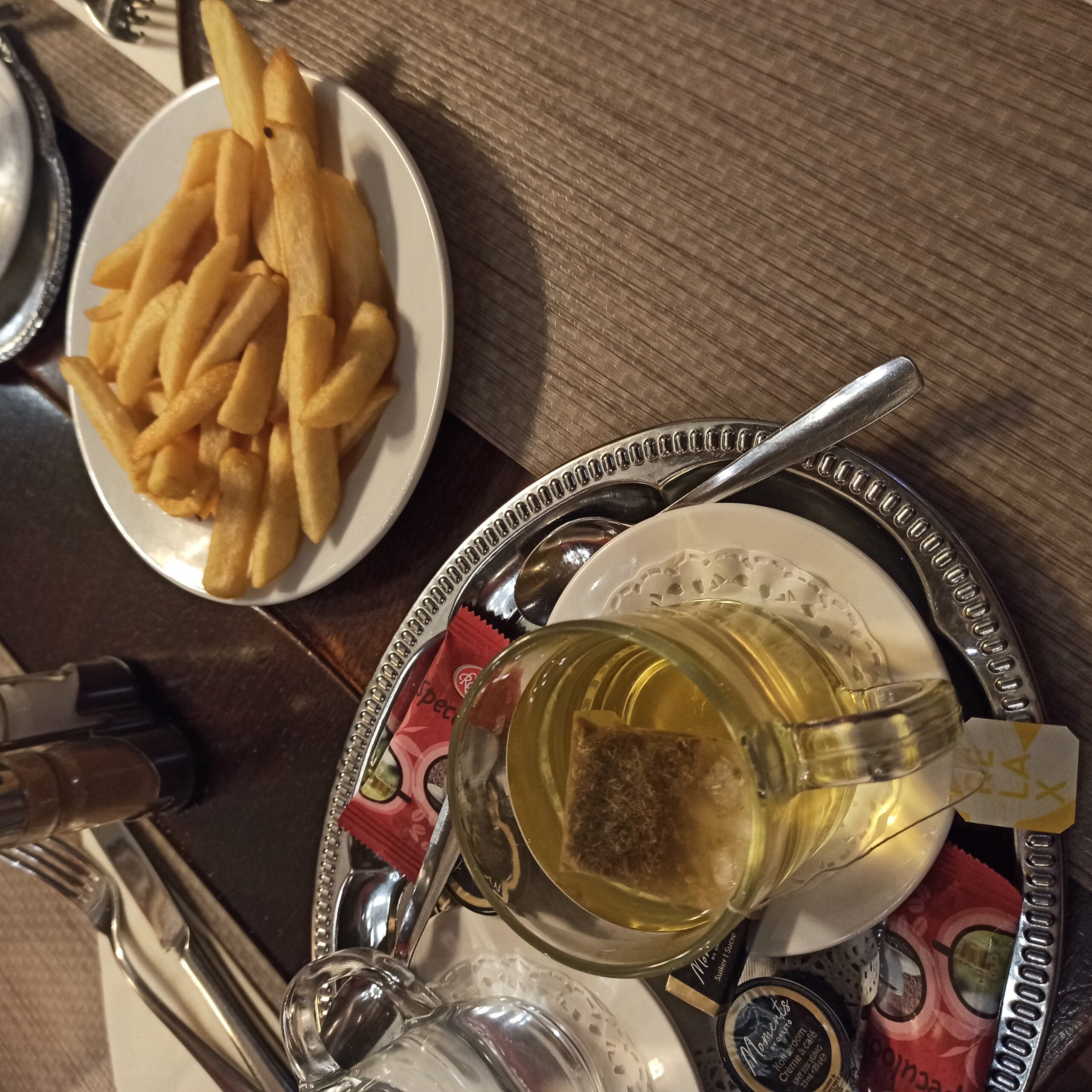 Tea and fries on the table