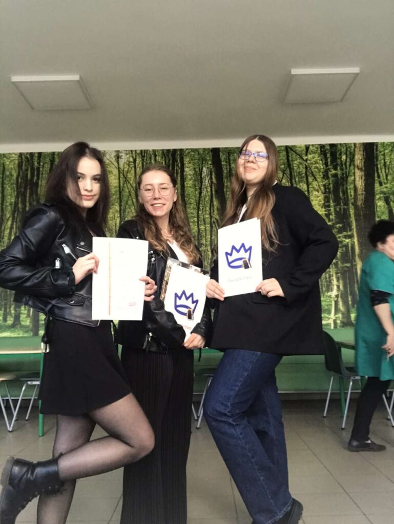 three girls with their diplomas