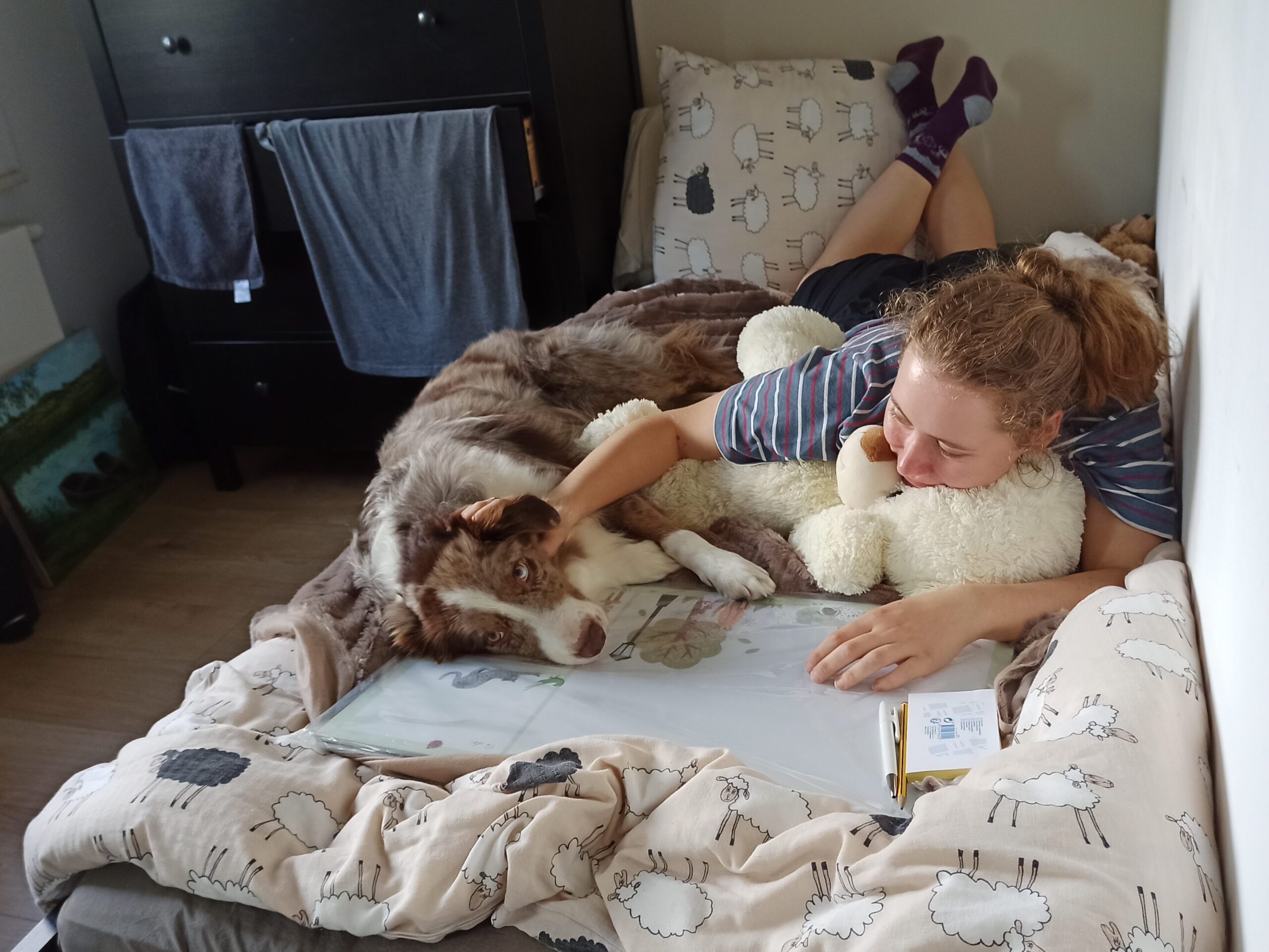 girl with dog on the bed