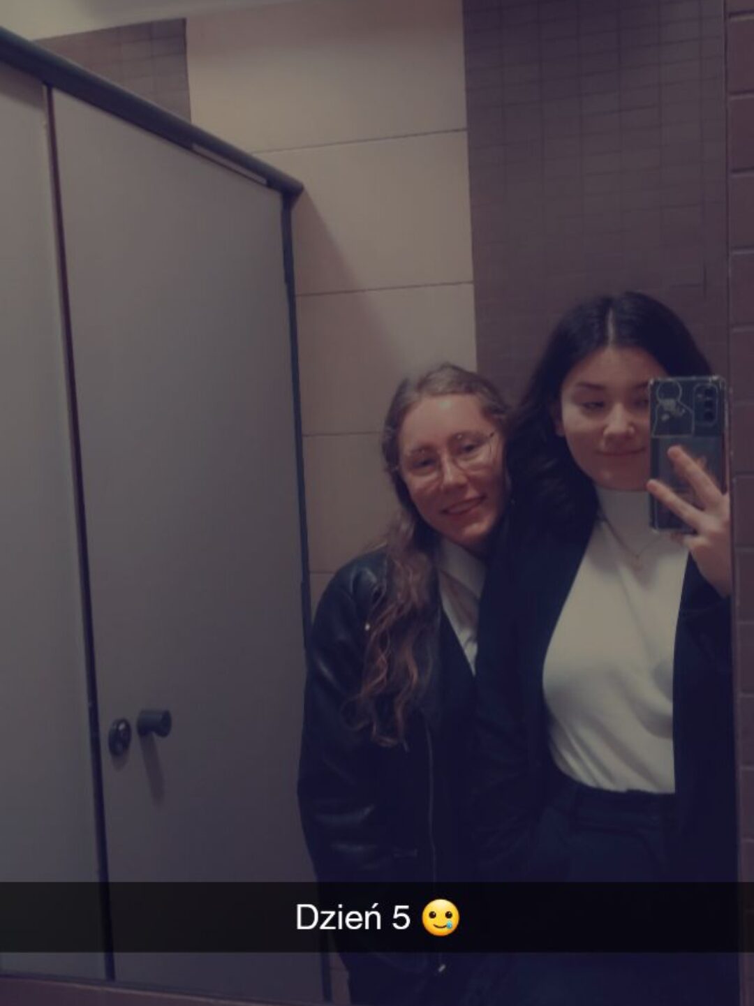 photo of two girls in the mirror